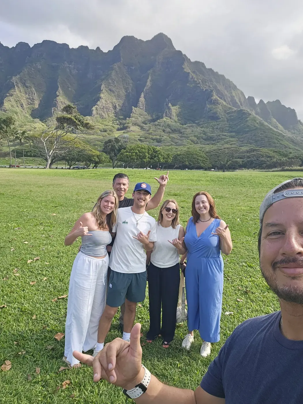 Daniel with guests in front of Oʻahu’s Koʻolau mountains
