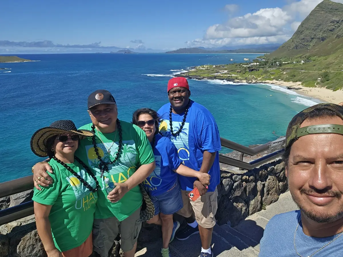 Daniel with guests at a scenic Oʻahu coastal lookout