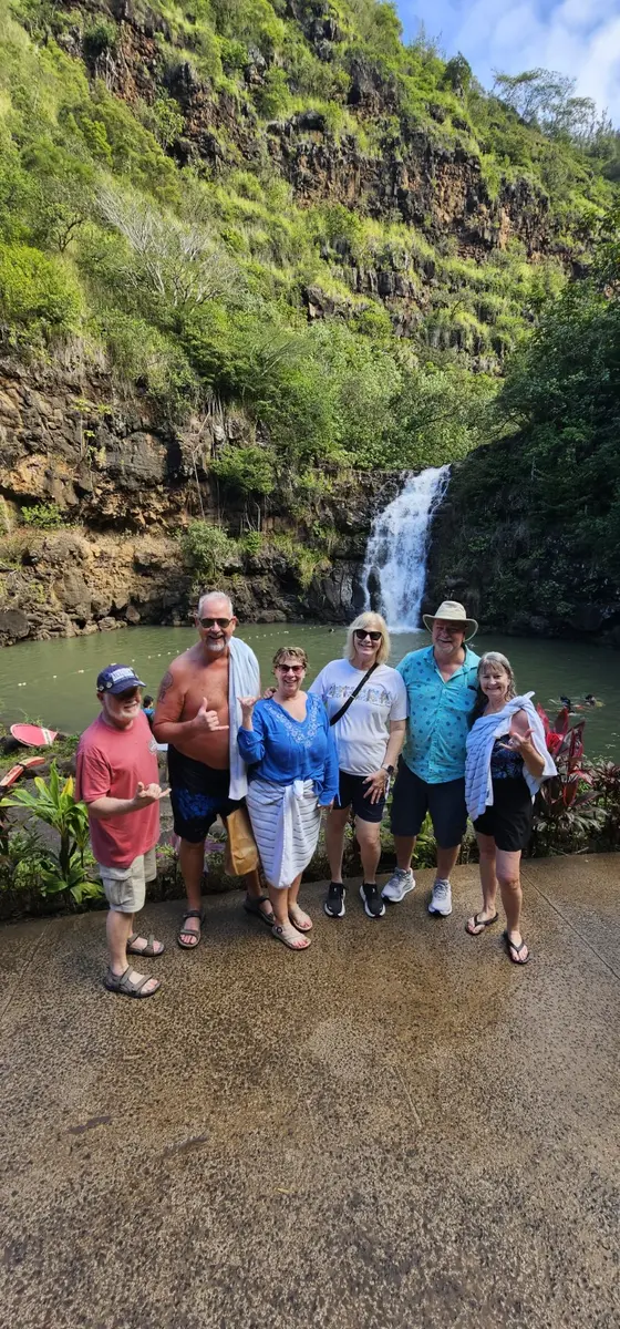 Daniel and guests at a North Shore waterfall