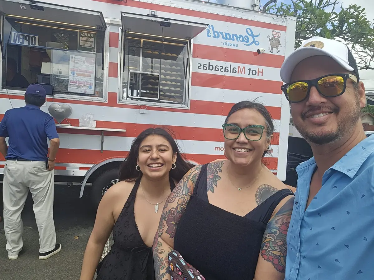 Daniel with guests enjoying local food