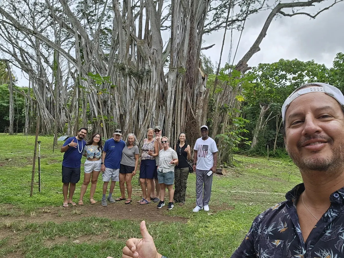 Daniel with a private group beneath a banyan tree