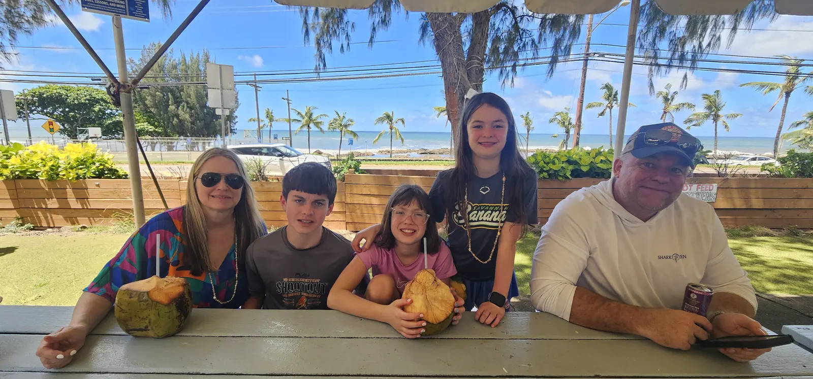 Family enjoying a relaxed North Shore local food stop