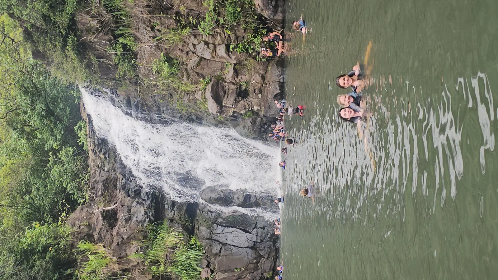 Guests swimming at Waimea Falls when conditions allow