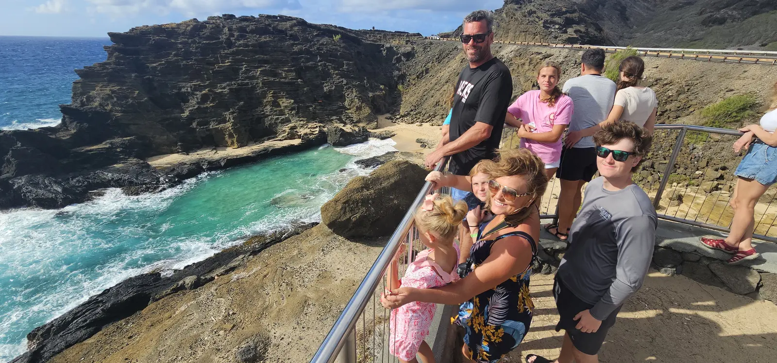 Family stopping for photos near Halona Blowhole