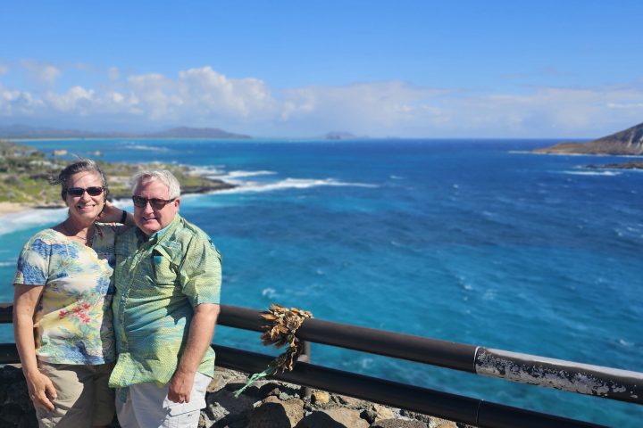 Couple enjoying a private Oahu tour at a coastal overlook