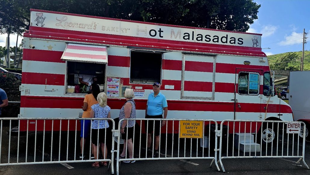 Cruise guests stopping at the Leonards Hot Malasadas truck